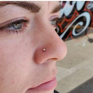 Nose piercing by Tim