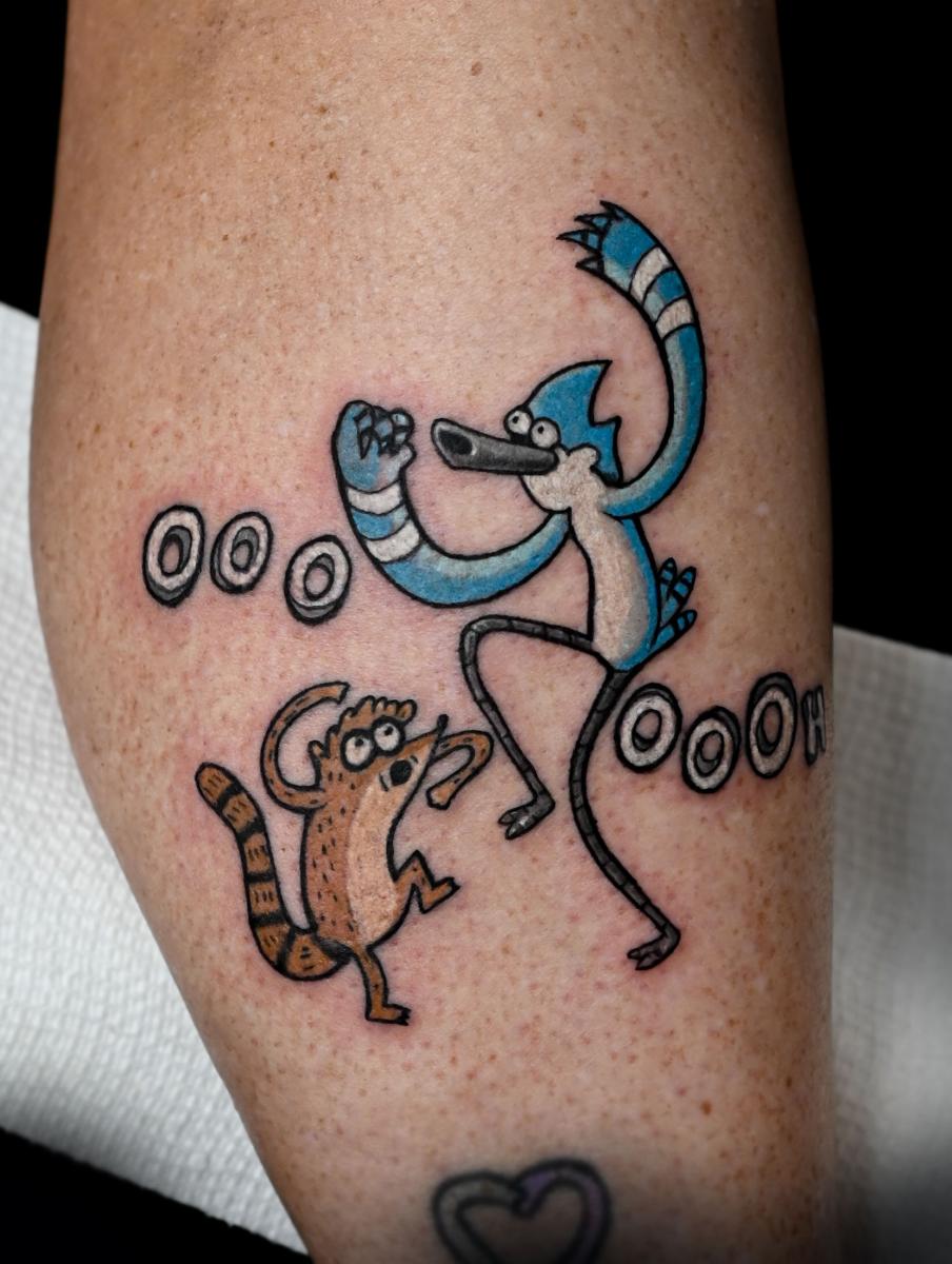 Julia Seizure Tattoo  That time I got to tattoo Mordecai and Rigby from  the Regular show having a light sabre battle on some best friends That was  a good day Prob